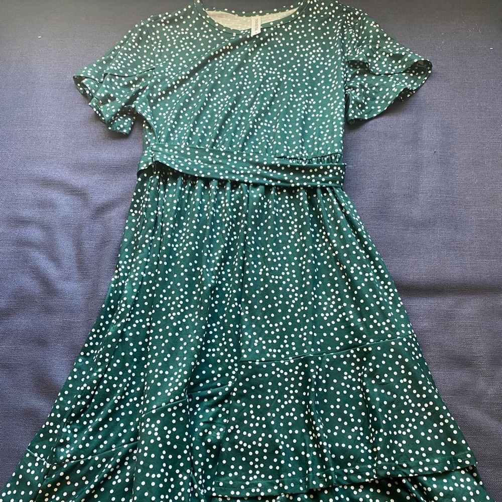 Green polka dotted knee length dress